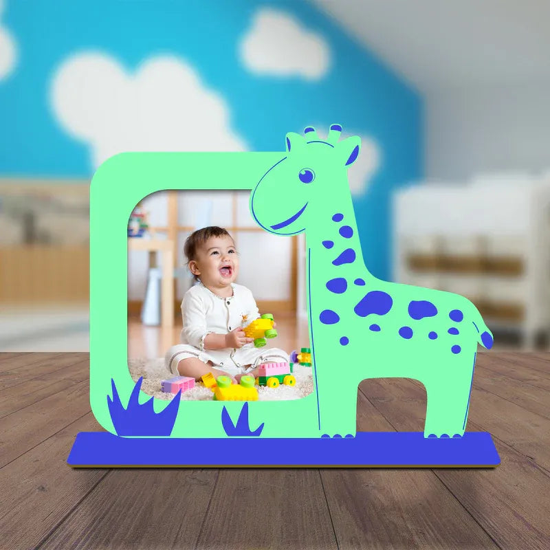  A colorful wooden giraffe-shaped picture frame displayed on a table with a happy baby inside the frame, set against a blurred background.