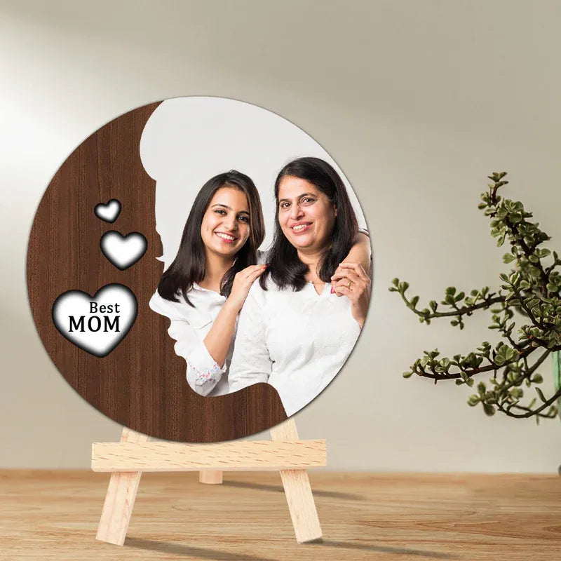 Circular wooden photo plaque with two smiling women and 'Best Mom' text on a stand.