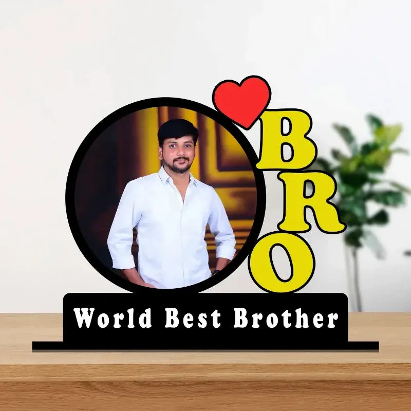 A custom photo plaque for a brother, featuring a circular cutout of a man in a white shirt, a red heart, and the word 'BRO' in bold yellow letters, mounted on a black base that reads 'World Best Brother'.