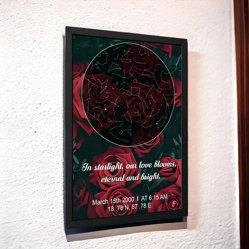 Framed artwork with red roses and constellation design on a white wall
