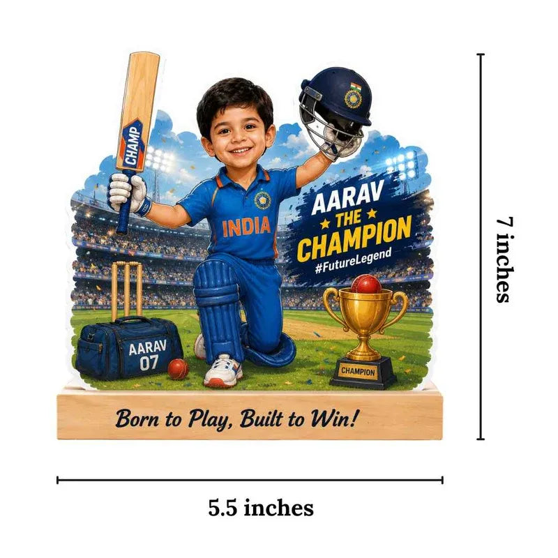 Figurine of a young boy in cricket gear with personalized text on a stand, set against a stadium backdrop.