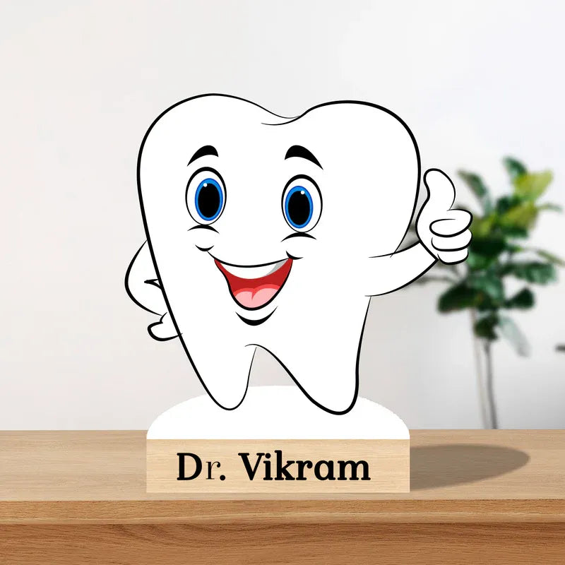 Cartoon tooth character with a nameplate on a wooden surface