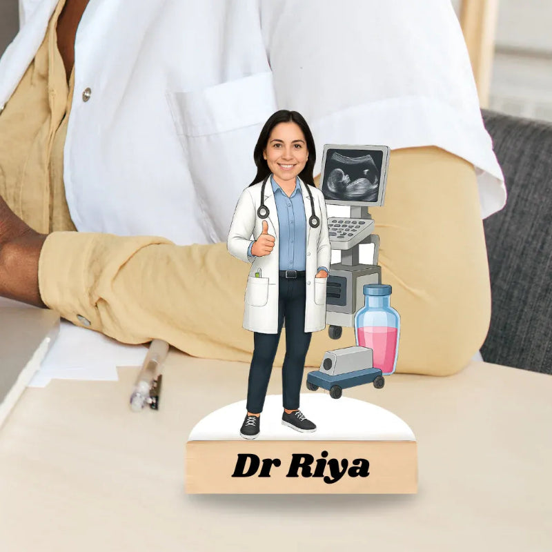 Figurine of a doctor named Dr. Riya with an ultrasound machine on a stand.