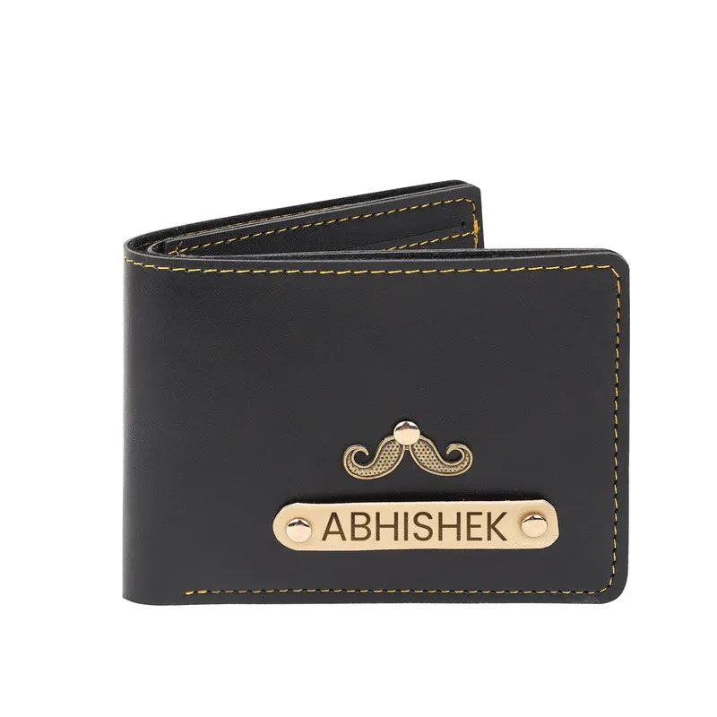 Black wallet with gold accents and 'ABHISHEK' engraving on a white background