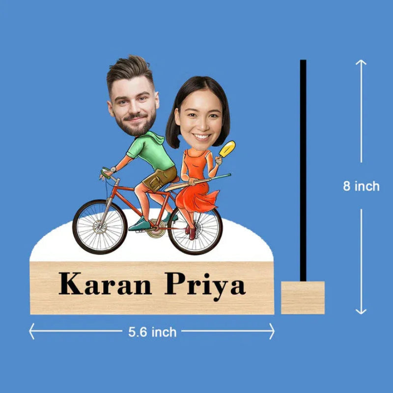 Caricature of a man and woman on a bicycle with dimensions labeled on a blue background