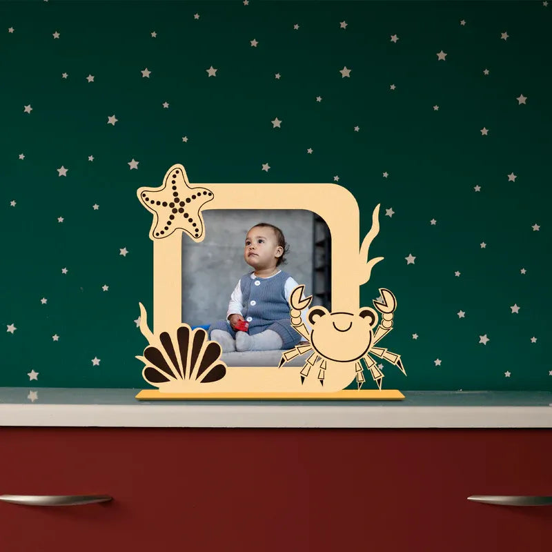 Decorative photo frame with animal designs on a green background