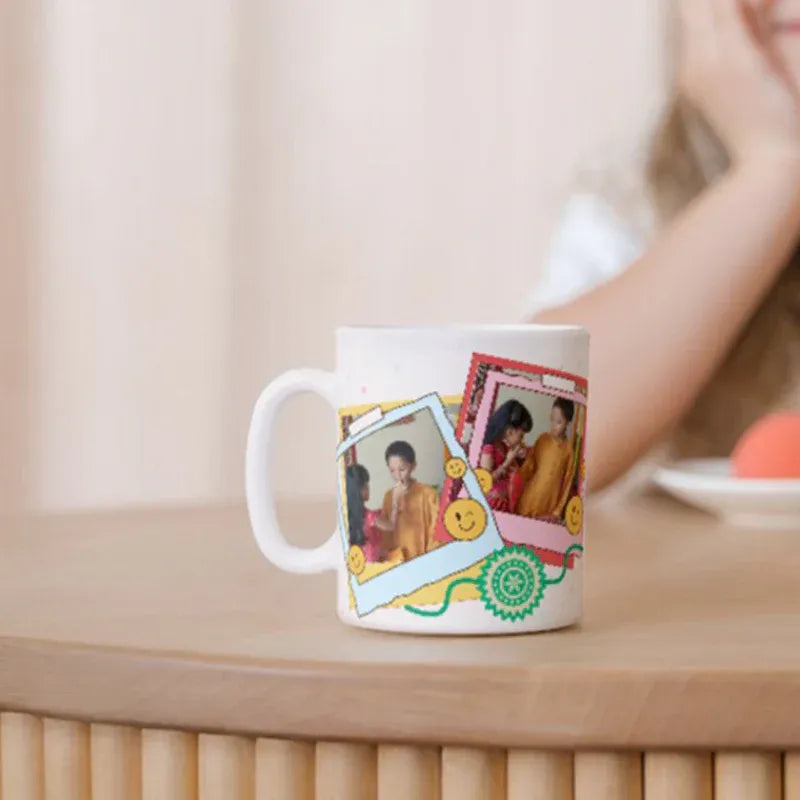 White mug with colorful design featuring people on a wooden surface.