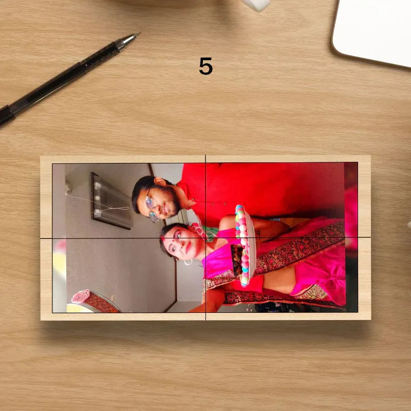 Wooden photo puzzle cube with two people on a wooden surface