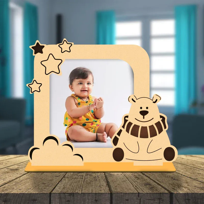 Wooden photo frame with a bear design on a wooden surface