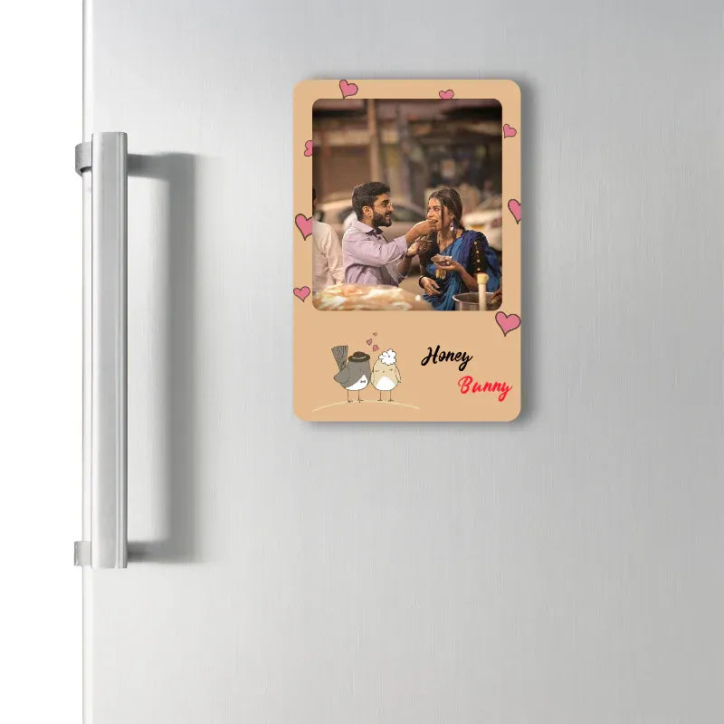 Personalized photo magnet with a couple on a refrigerator