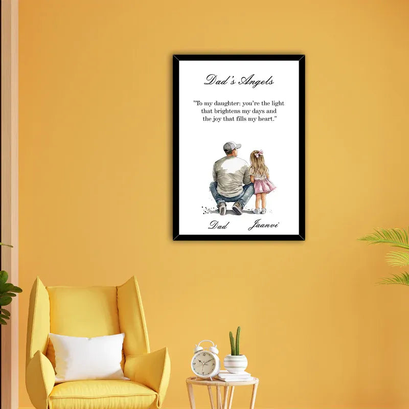 Framed artwork on a yellow wall with a yellow chair and small table in the foreground.