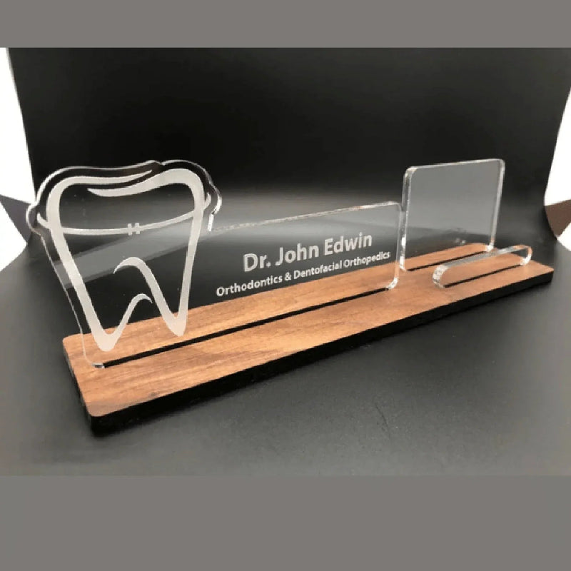 Personalized desk nameplate with dental theme on a wooden base