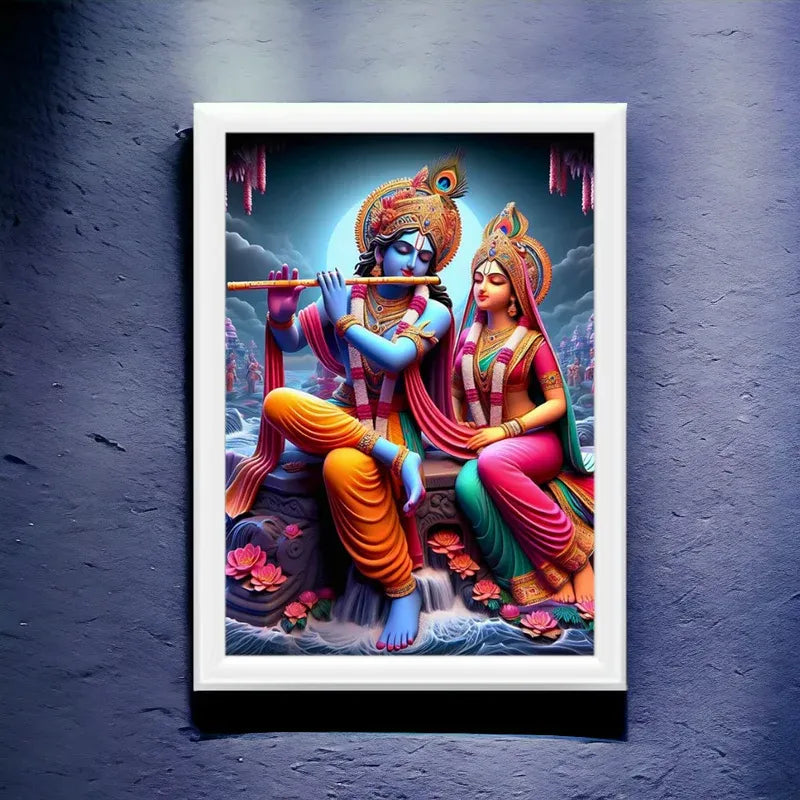 Framed artwork of two deities in colorful traditional attire on a dark blue textured wall.