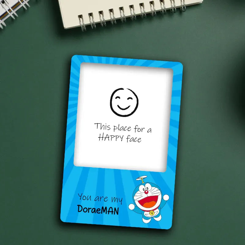 Blue photo magnet with a cartoon character and text on a green background