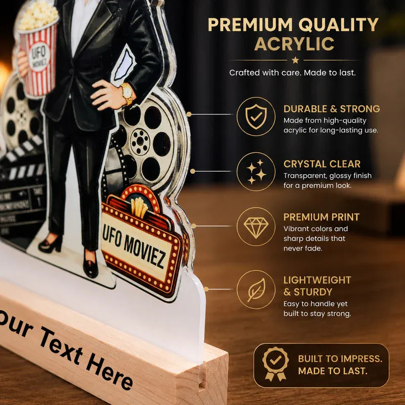 Acrylic standee of a person in a suit with movie-themed props, featuring text about premium quality acrylic.