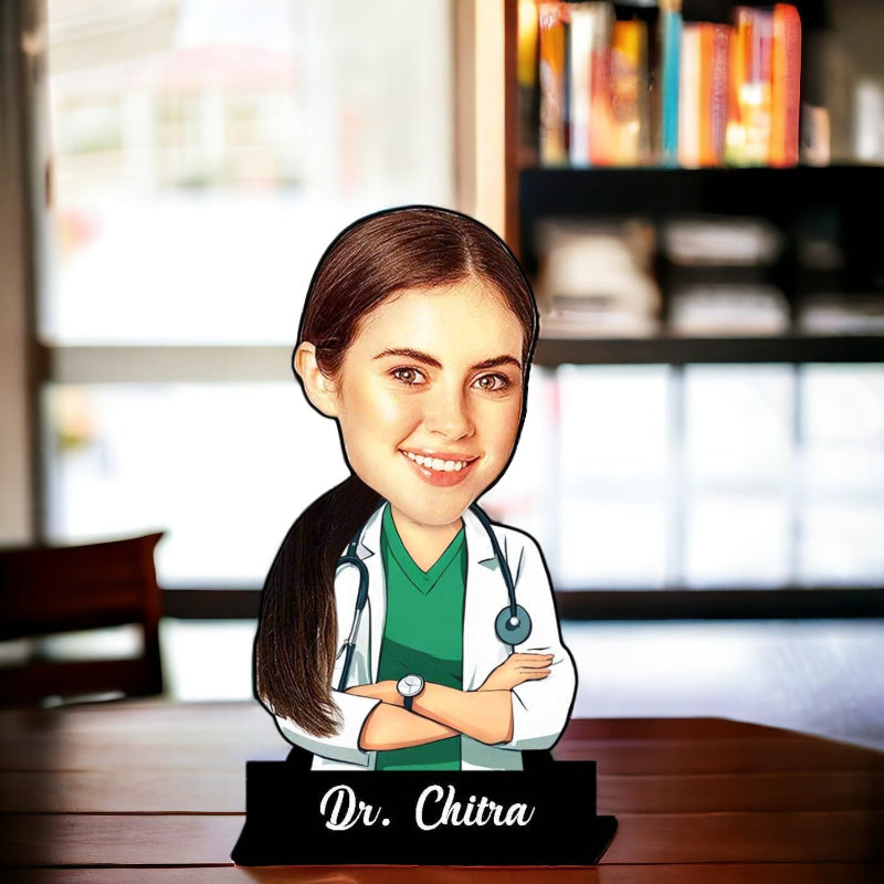 A custom caricature of a female doctor with a name plate reading 'Dr. Chitra'.