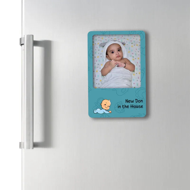 fridge magnet picture of a baby on a refrigerator with text 'New Don in the House'.