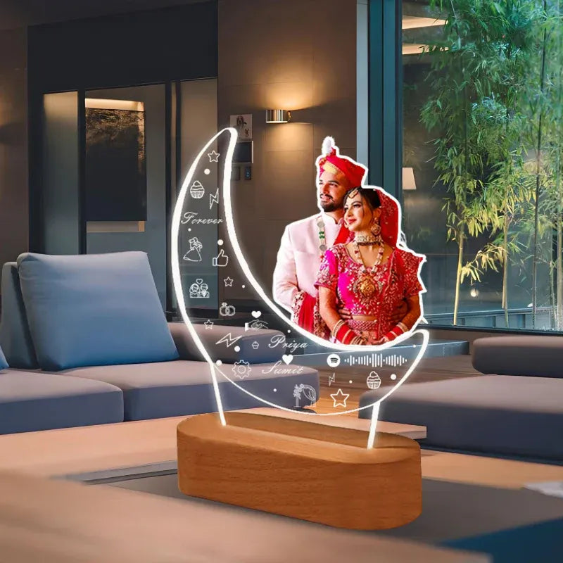 Decorative lamp with a couple's photo on a table in a modern living room.