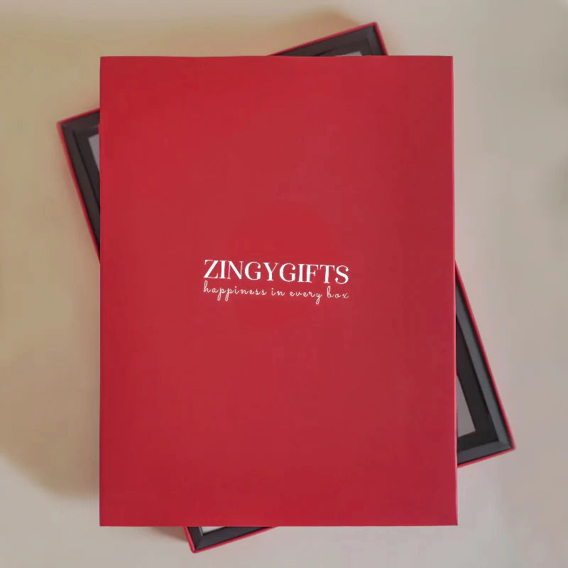 Red gift box with 'ZINGYGIFTS' branding on a beige background