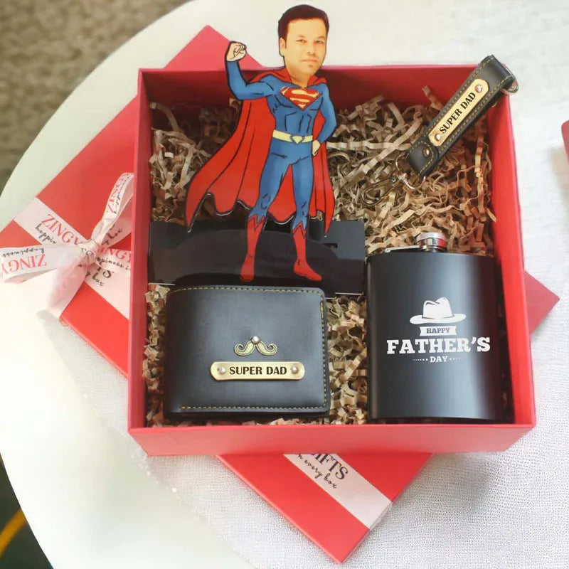 Gift set with Superman figurine, wallet, and mug in a red box.