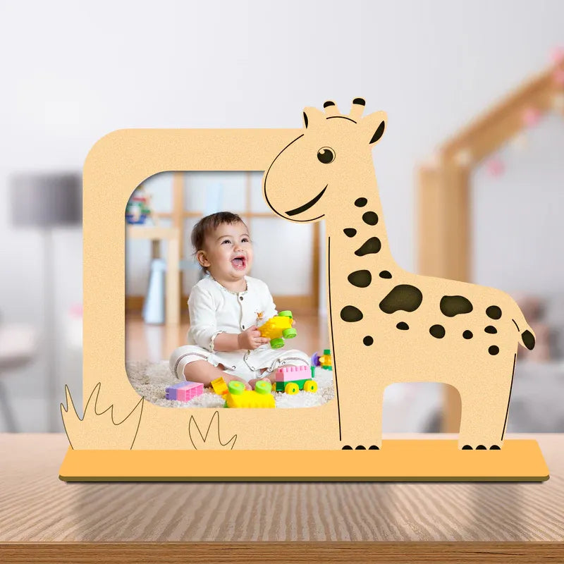 Wooden giraffe photo frame with a child's photo inside, placed on a wooden surface.