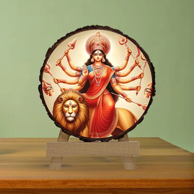 Decorative wall art of a multi-armed goddess with a lion on a wooden stand against a green wall.