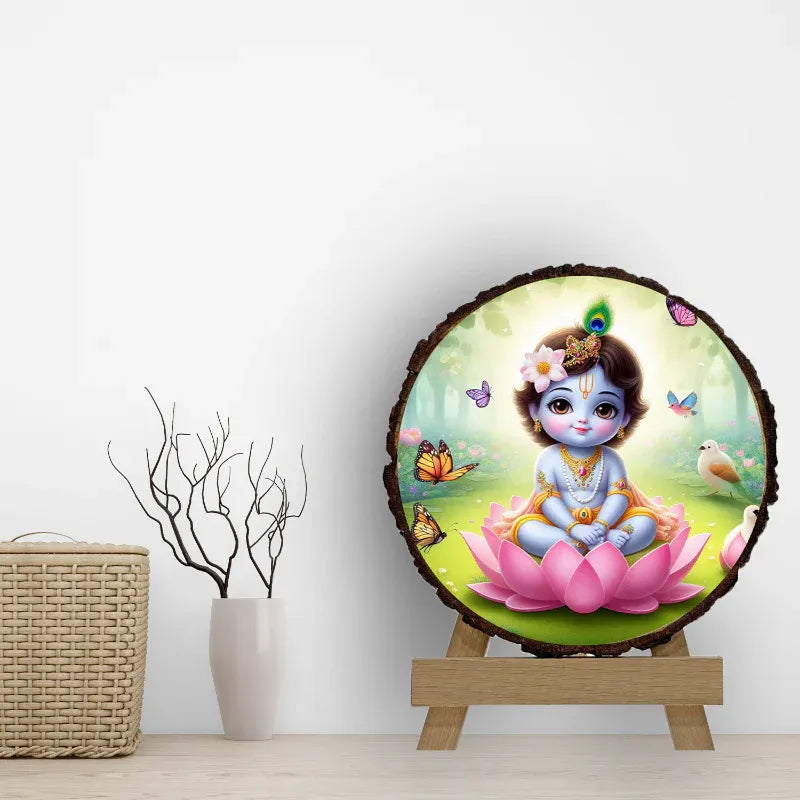Decorative wall art with a cartoon character sitting on a lotus flower, surrounded by butterflies, on a wooden stand.
