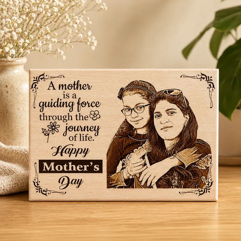 Wooden plaque with engraved portrait of two women and a Mother's Day message.