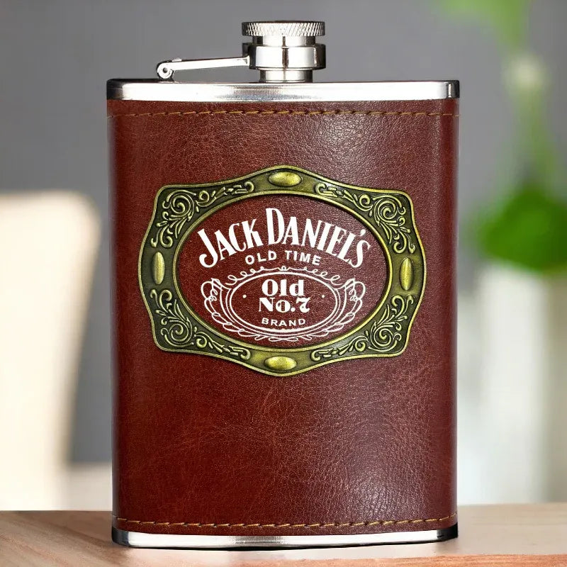 Jack Daniel's leather flask on a wooden surface with a blurred background