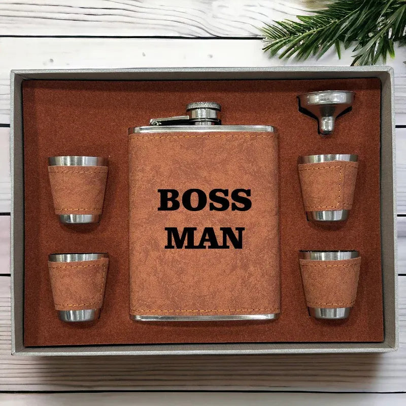 Brown flask set with 'BOSS MAN' text on a wooden surface