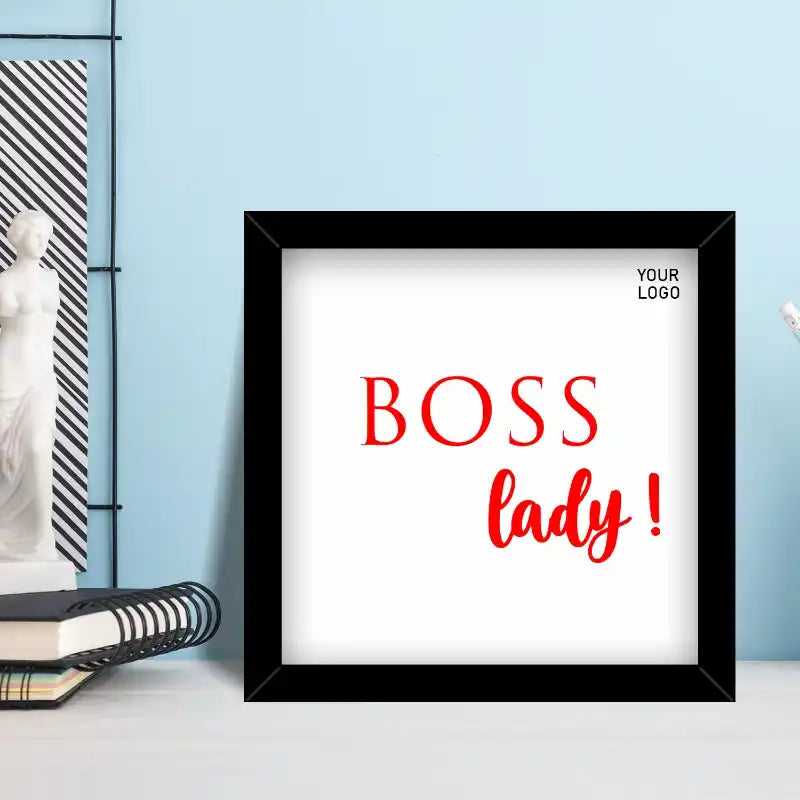 Corporate photo frame for lady boss displayed on office desk with lamp