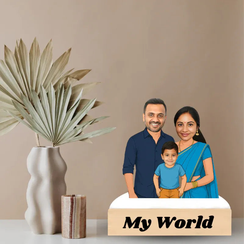 Family photo on a decorative box with 'My World' text, next to a vase and plant.