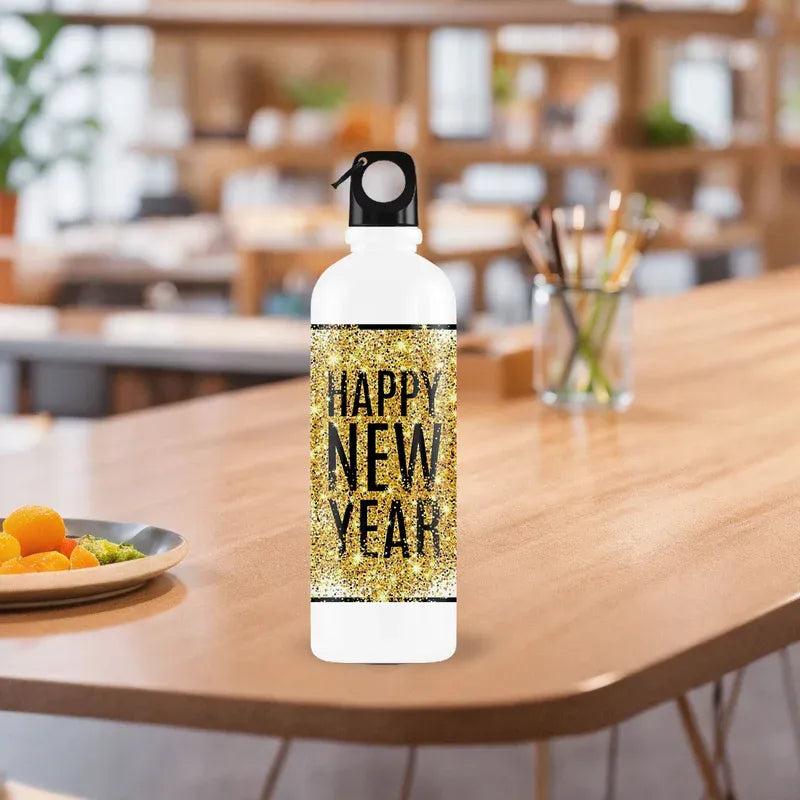 White water bottle with 'Happy New Year' text on a wooden table in a blurred indoor setting