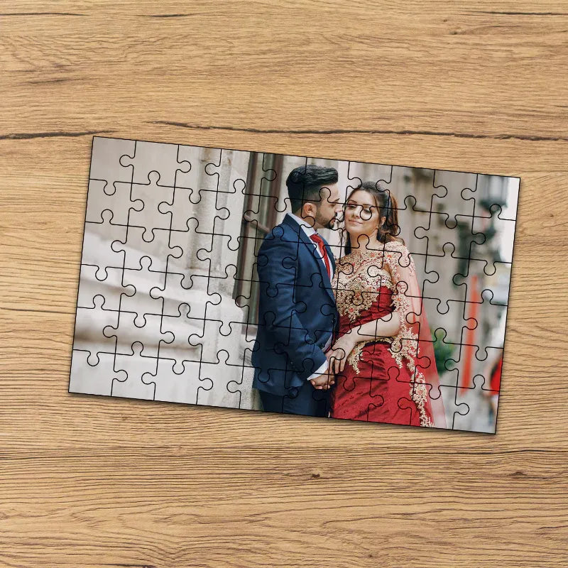 Jigsaw puzzle with a couple in formal attire on a wooden surface