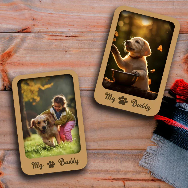 Two wooden fridge magnets featuring personalized photos of a child with a puppy and a different photo of a child and a puppy together, placed on a wooden surface with a knit fabric in the background.