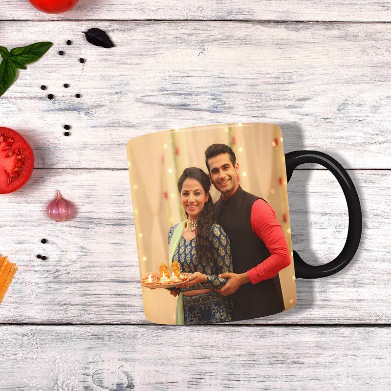 Personalized mug with a couple holding a tray of food on a wooden surface.