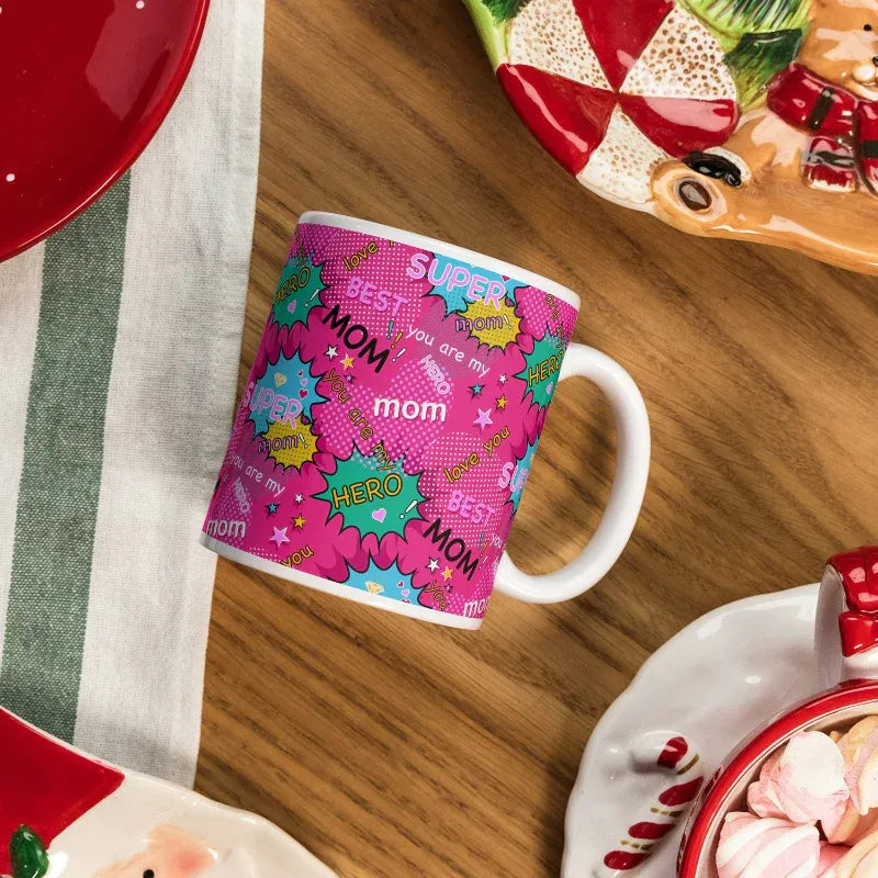 Colorful mug with 'Super Mom' text on a wooden table