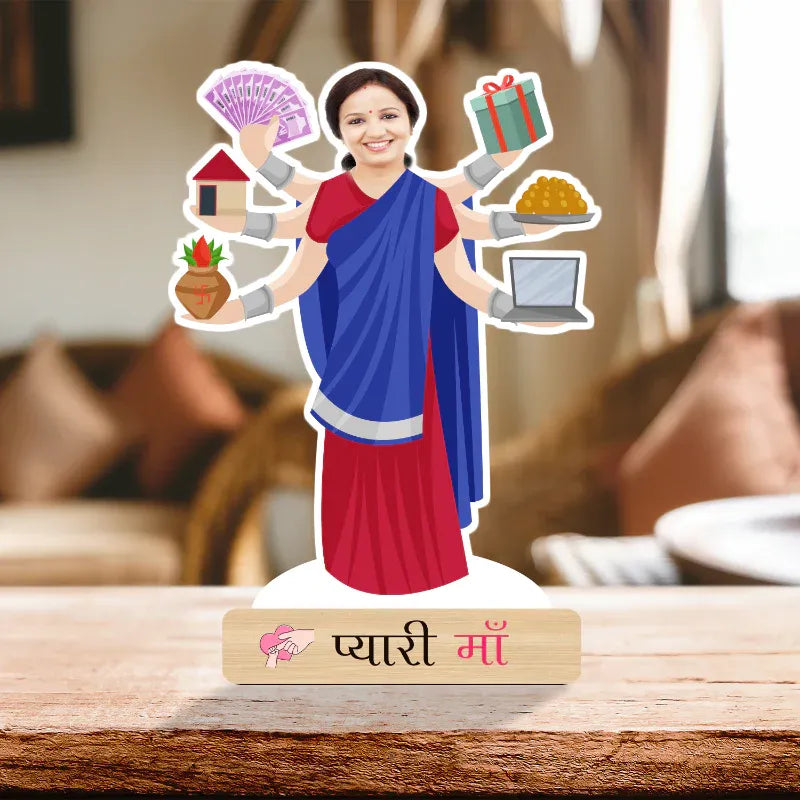 Figurine of a woman in a saree holding various icons on a wooden surface.