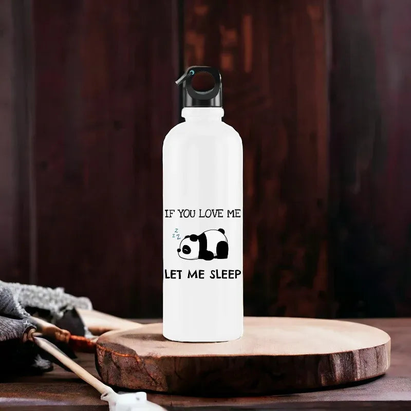 White water bottle with panda design and text on a wooden surface