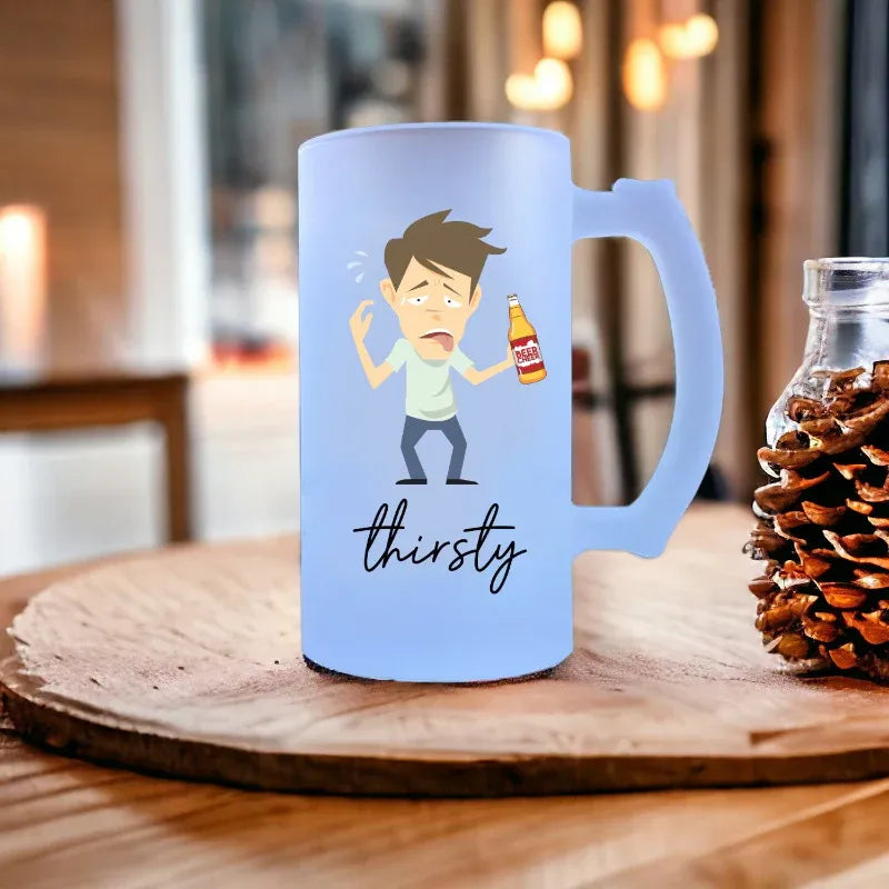 Light blue mug with cartoon character and 'thirsty' text on a wooden surface.
