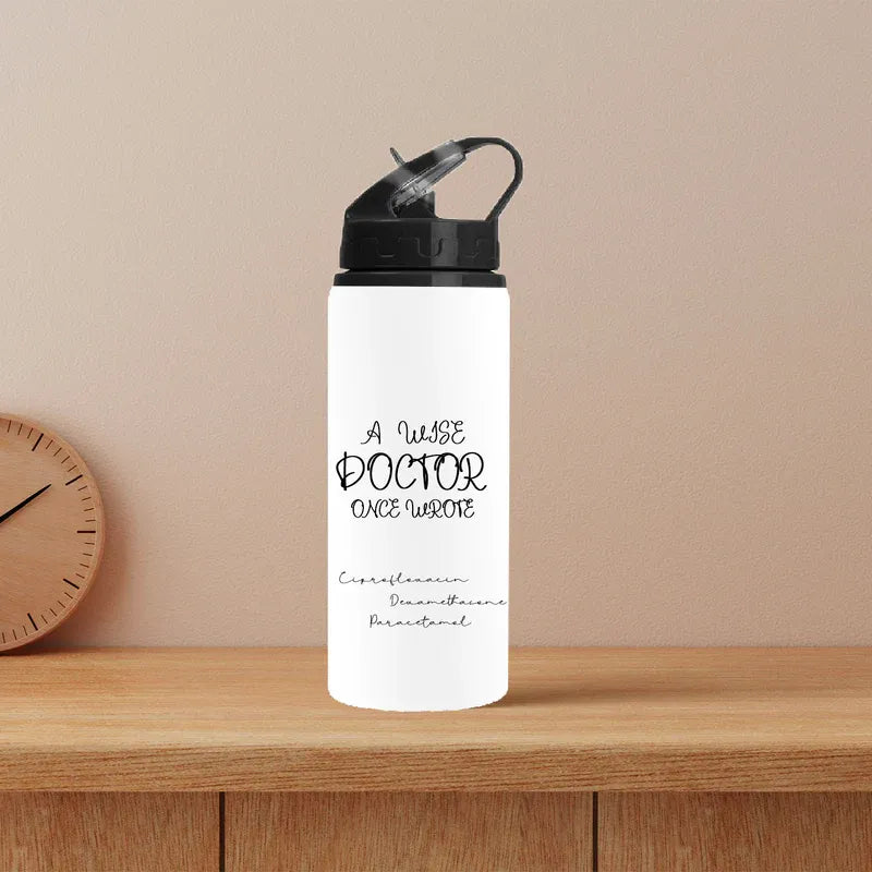 White water bottle with text on a wooden shelf against a beige wall