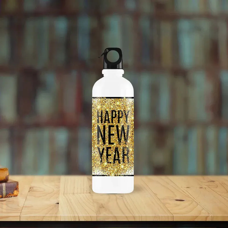 Water bottle with 'Happy New Year' text on a wooden surface with a blurred background