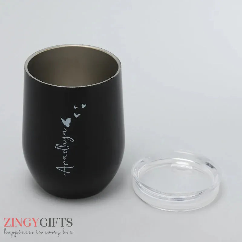 Black tumbler with 'Ardhnya' branding on a gray background