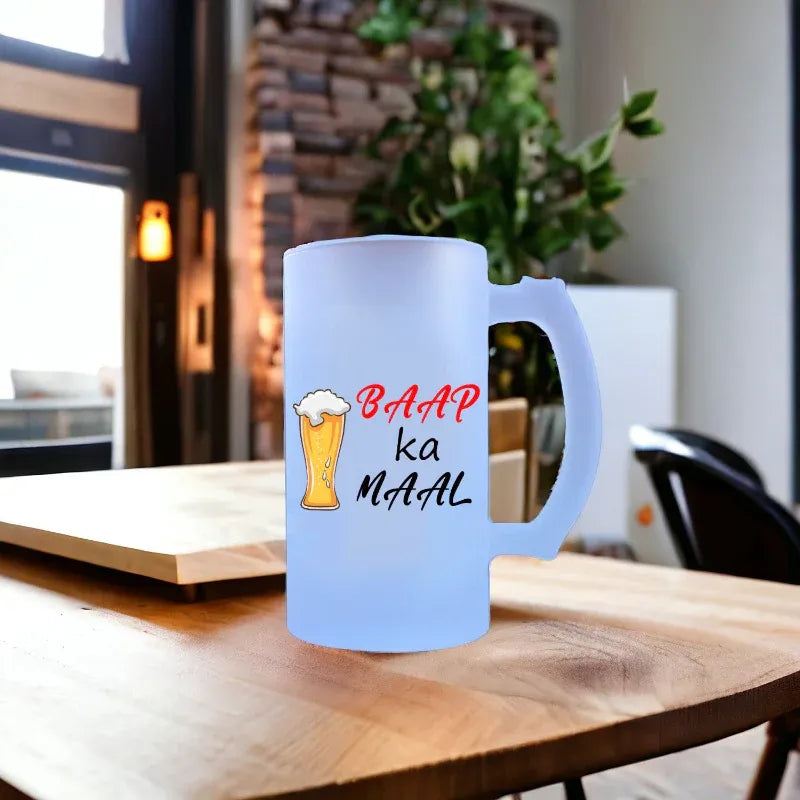 Blue mug with text and beer illustration on a wooden table