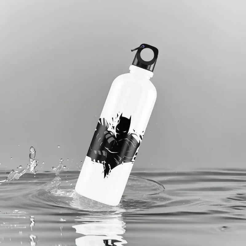White water bottle with black batman design partially submerged in water on a gray background