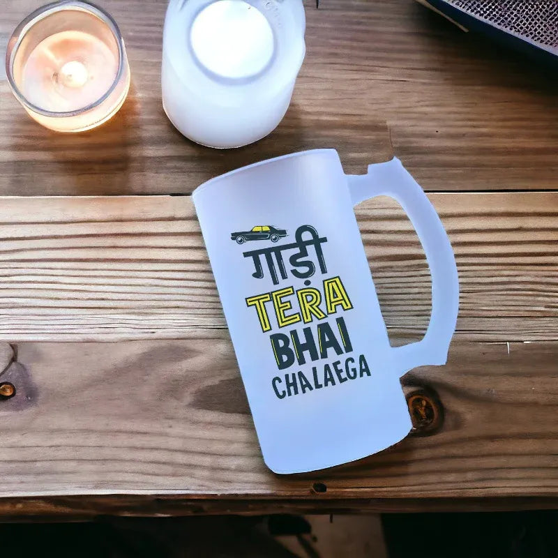 White mug with text on a wooden surface with candles