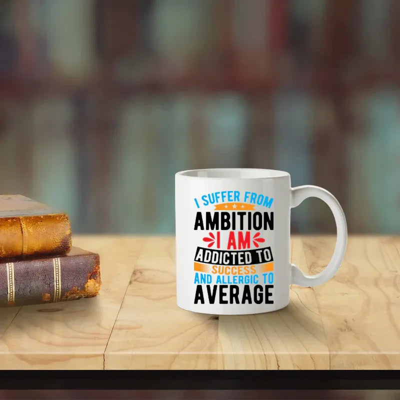Mug with motivational quote on a wooden table with books in the background