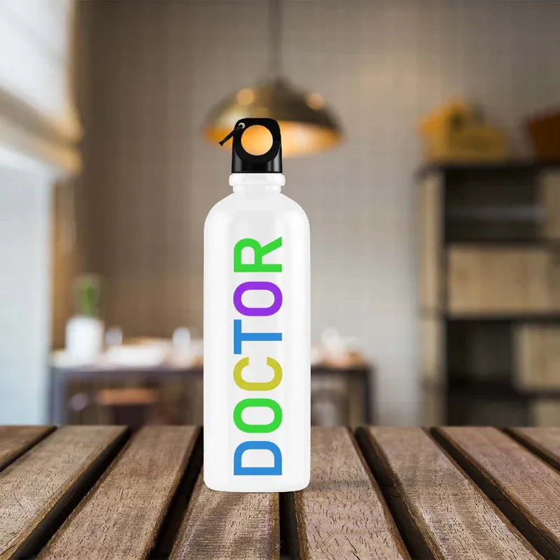 White water bottle with 'DOCTOR' in colorful letters on a wooden surface.