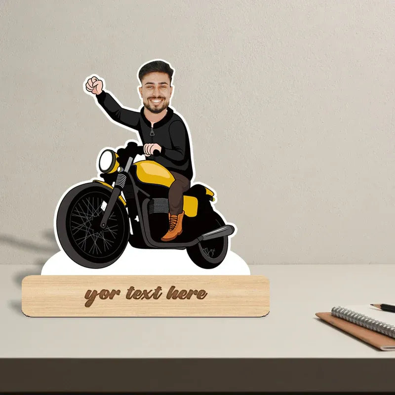 Customizable motorcycle with a person on it and a wooden block for text, on a neutral background.