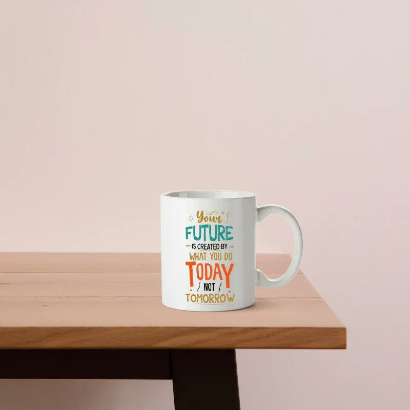 Mug with motivational quote on a wooden table against a light pink background